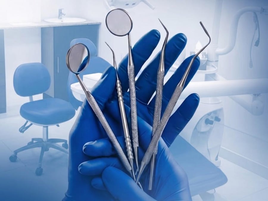 Dentist consulting with a patient at Reliance Hospital